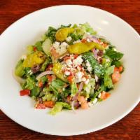 Greek Salad · Crisp romaine lettuce, tomatoes, roasted red peppers, feta cheese, black olives, cucumbers, ...
