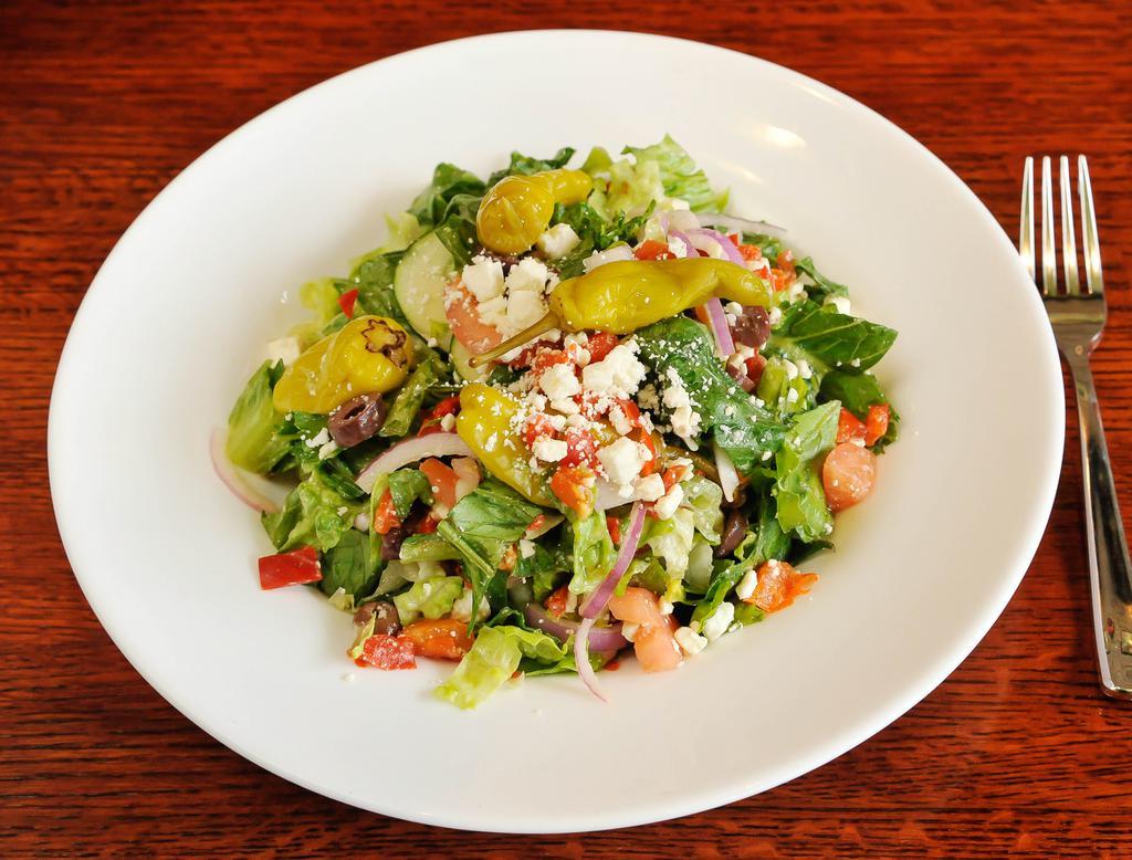 Greek Salad · Crisp romaine lettuce, tomatoes, roasted red peppers, feta cheese, black olives, cucumbers, red onions and Athenian Greek dressing.