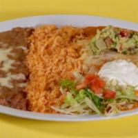 Enchiladas Suizas · 2 pieces of enchiladas topped with El Tule red sauce, your choice of meat and one side of so...
