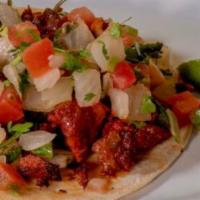 Regular Taco · Served in a single corn tortilla, meat, pico de gallo, and lime.
