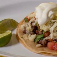 Super Taco · Served in a double corn tortilla, meat, pico de gallo, cheese, sour cream and guacamole, and...