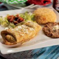 Chimichanga · Stuffed golden brown deep fried flour tortilla with beef or shredded chicken, topped with ch...