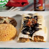 Burrito de La Roqueta · Two soft flour tortillas filled with an exquisite choice of chicken or pork, topped with cre...
