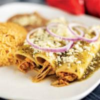 Enchiladas Verdes · Green Verde sauce softly coat three delicious, savory chicken enchiladas, topped with cheese...