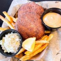 Crab Cake Basket · 2 Carolina Style Crab Cakes
Served with white slaw, fries, a remoulade dippin' sauce, and a ...