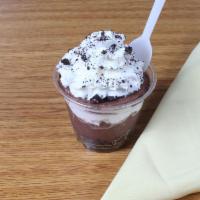 Grammi's Mud Pie · Layers of chocolate pudding, crushed Oreo's and whipped cream.