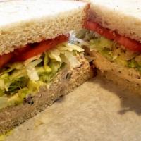 Fisherman's Wharf Sandwich · Albacore tuna salad served on sliced sourdough bread, with shredded iceburg lettuce, sliced ...