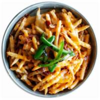 Cheese Fries · A shareable portion of fries, Monterey Jack and cheddar cheese, queso, chopped bacon & grill...
