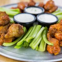 12 Pieces Wings · Tossed in your choice of sauce, served with celery and ranch or blue cheese.