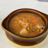 Manhattan Clam Chowder · A thick hearty soup consisting of clams, potatoes, onions within a milk or cream base.
