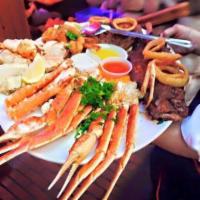 King Crab Legs and Baby Back Ribs Combination · Broiled king crab legs and 1/2 rack of BBQ baby back ribs.