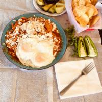 6. Chilaquiles Mexican Style · Fry corn tortilla with red sauce and cheese. Add eggs and steak for an additional expense.