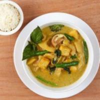 Green Curry · Thai green coconut curry with green bean, eggplant, basil, and bamboo shoot.