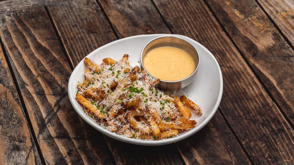 Truffle Cheese Fries · Truffle salt, Parmesan, green onion and white truffle cheese sauce.