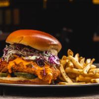 Spicy Fried Chicken Sandwich · Coleslaw, house pickles and firecracker aioli.