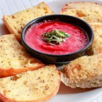 Garlic Bread · Baked golden brown and served with a side of our warm pizza sauce.