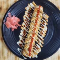 Las vegas roll · Deep fried roll in crabmeat, cream cheese, salmon, avocado with eel sauce, spicy mayo, srira...