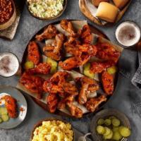 Wing Family Pack · The Wing Family Pack includes 24 smoked chicken wings (12 flats, 12 drummies), topped with y...