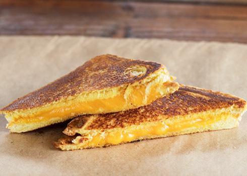 Grilled Cheese · You will love our delicious new grilled cheese made with two slices of Texas Toast and savory, melted cheddar cheese
