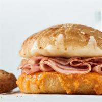 Kid's Grilled Cheese Sandwich · 3 cheeses | signature sauce | sourdough bun choice to add: ham | smoked turkey | chicken