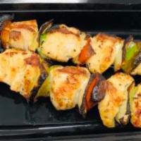 Chicken Skewers · Two pieces. Grilled chicken tenders with peanut sauce on the side.