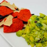 White Corn Guacamole and Chips · Diced avocado, sweet white corn,black beans,jicama, red bell pepper and jalapeño peppers