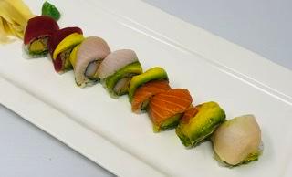 Rainbow Roll · Crabmeat, avocado and tabiko, topped with assorted fish. 