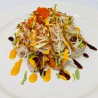 Mt. Fuji Roll · Peppered tuna and avocado wrapped with soy paper, topped with spicy crunchy kani salad, chef...
