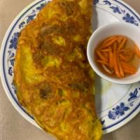 10. Banh Xeo · Vietnamese pancake with shrimp and pork.