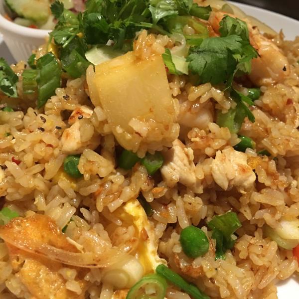 34. Pineapple Fried Rice · Stir fried rice with chicken, shrimp, cashew nuts, pineapple, onions and touch of curry powder.