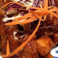 59. Orange Chicken a la Carte · Deep-fried chicken sauteed in sweet and orange tangy sauce.