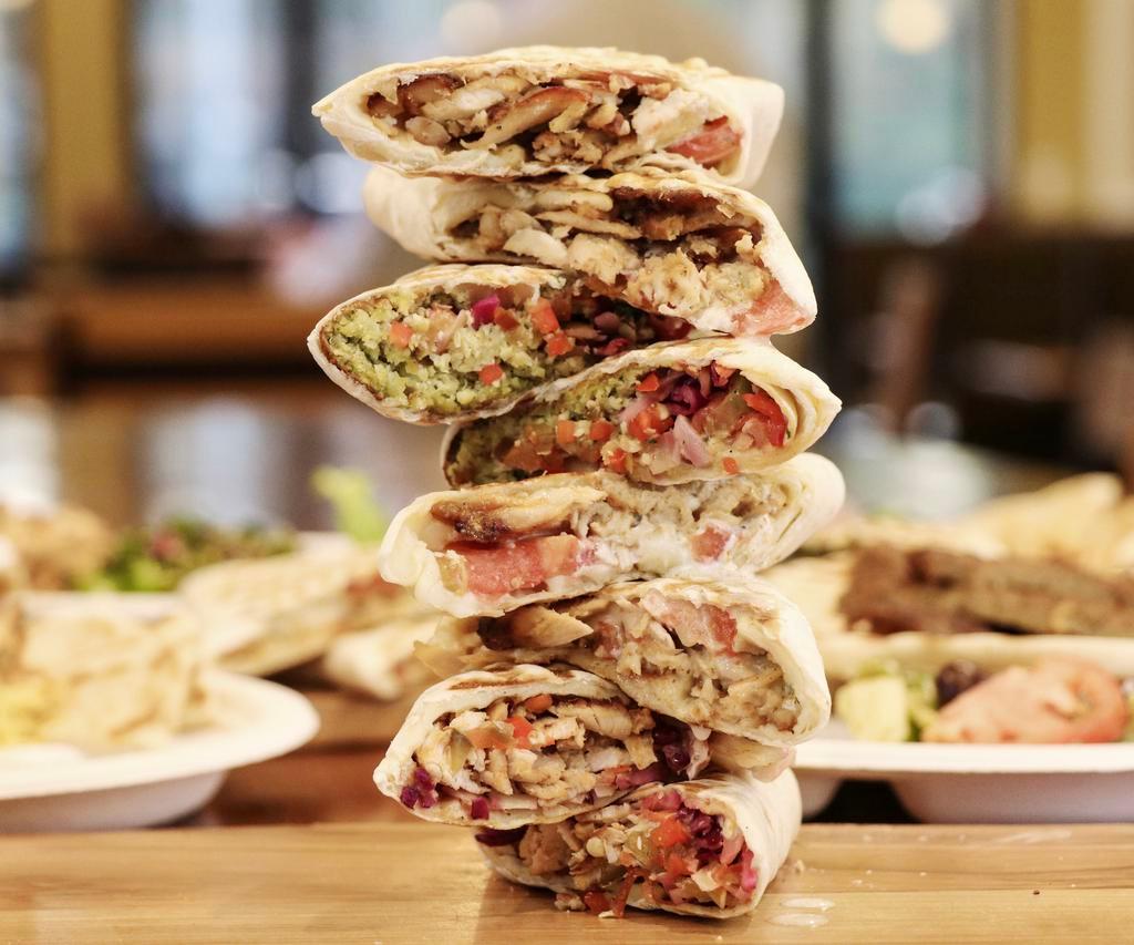 Mixed Panini For 4 · Served with: 
1/2 lb Hummus 
1/2 lb Tatziki 
Greek Salad for 4 
4 Pitas 
4 Sauces 

Choose 4 Paninis: 
Chicken Zaki 
Pesto Chicken 
Gyro Pita 
Falafel Panini 
Please put in the special instructions how many of each panini you would like 