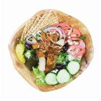 Chicken Greek Salad · Jasmin chicken over traditional Greek salad and a half pita.