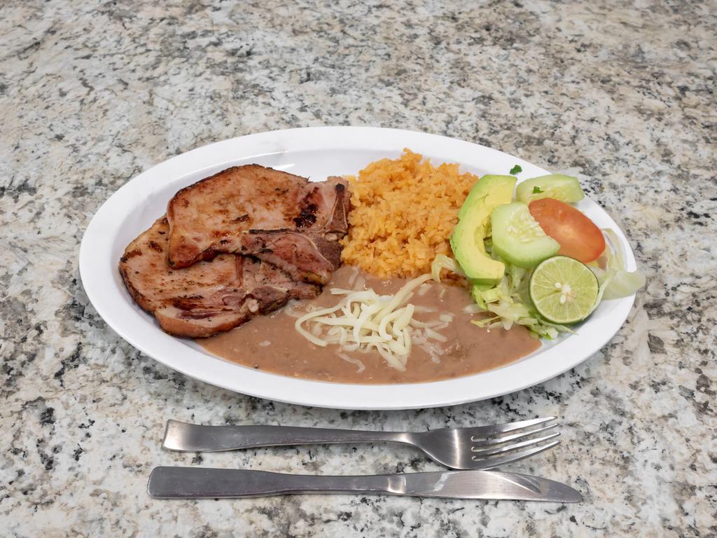 Chuleta Ahumada · Two smoked pork chops and 5 corn tortillas served with Mexican-style rice, refried beans, and a small salad.
