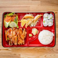 Chicken Teriyaki Bento Box · Rice, salad, 4 pieces of California Roll, 3 pieces of pork and vegetable gyoza (fried dumpli...