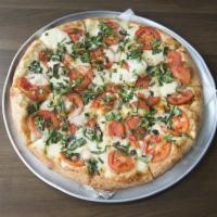 Margarita Pizza · Fresh mozzarella, basil and tomatoes drizzled with olive oil.