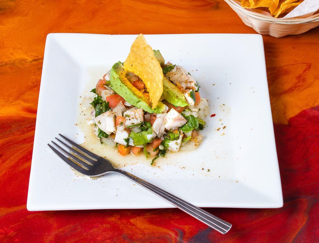 Ceviche · Fish marinated in lime juice and seasoned with tomatoes and onions.