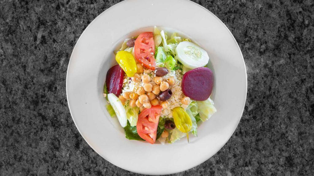 The Best Greek Salad · Small. Crisp iceberg and romaine lettuce, tomatoes, chickpeas, feta cheese, pepperoncinis, Kalamata olives, cucumbers and beets served with our best Greek dressing.