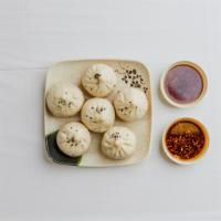 10. Pork Sheng Jian Bao · Fresh daily wrapped pan fried pork buns with scallions and chicken broth. The sesame seeds o...