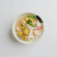 16. Seafood Wonton Noodle Soup · Handmade pork and shrimp wontons  with handmade wgg noodles topped off with squid, shrimp an...