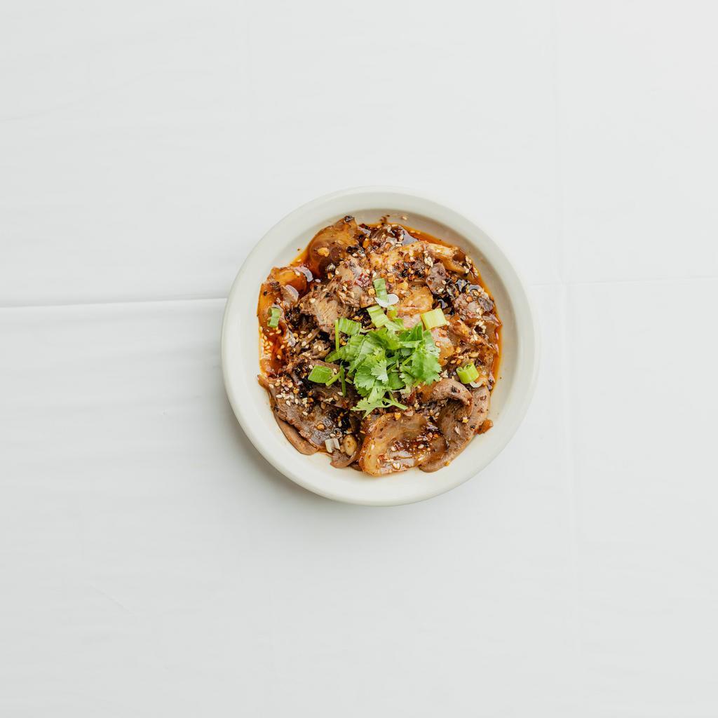 34. Fu Qi Fei Pian · Cold cuts of beef tripe, beef tongue, beef tendon, and beef belly marinated in Szechuan chili oil. Topped off with scallions and cilantro. 