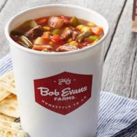Family Size Hearty Beef Vegetable Soup · Tender beef cooked in a tomato broth loaded with carrots, corn, tomatoes, potatoes, celery a...