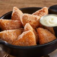 Cinna-Biscuits · Made-to-order fried biscuit dough dusted wth cinnamon sugar and served with warm cream chees...
