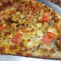 Pesto Pizza · Pesto sauce, sun dried tomatoes, crispy chicken, fresh mozzarella.