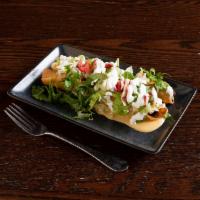 Chicken Flautas · Annatto shredded chicken topped with lettuce, sour cream and cotija cheese.
