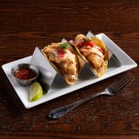 Baja Fish Tacos · Crispy beer battered white fish, cabbage slaw, chipotle dressing and pico de gallo.