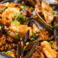 Arroz a la Tumbada (Real Mexican Paella) · Mussels, clams, shrimp, shredded crab meat and spicy chorizo.