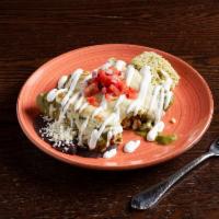 Enchiladas de Pollo · Corn tortillas, shredded chicken tinga, melted chihuahua cheese, crema Mexicana with rice an...