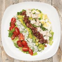 Chicken Cobb Salad · Roasted chicken, romaine, avocado, grape tomatoes, hard-boiled eggs, bacon, gorgonzola, and ...