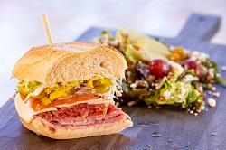 Club Sandwich (Half) · With soup or salad. Roasted turkey, ham, bacon, tomato, lettuce, mayo, and provolone.